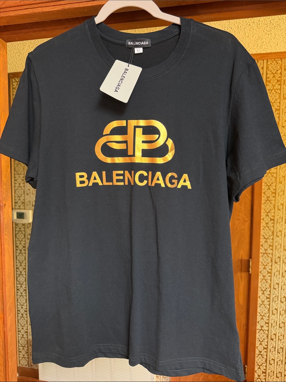 Balenciaga Black Tee with Metallic Gold Logo